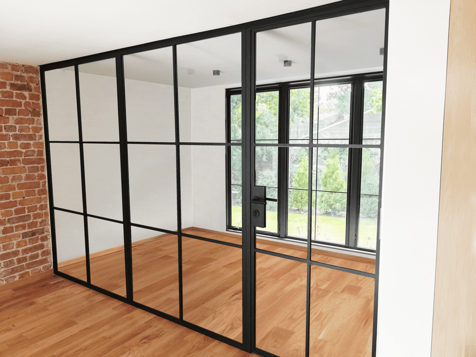 Metal and glass partition wall in loft style for office.