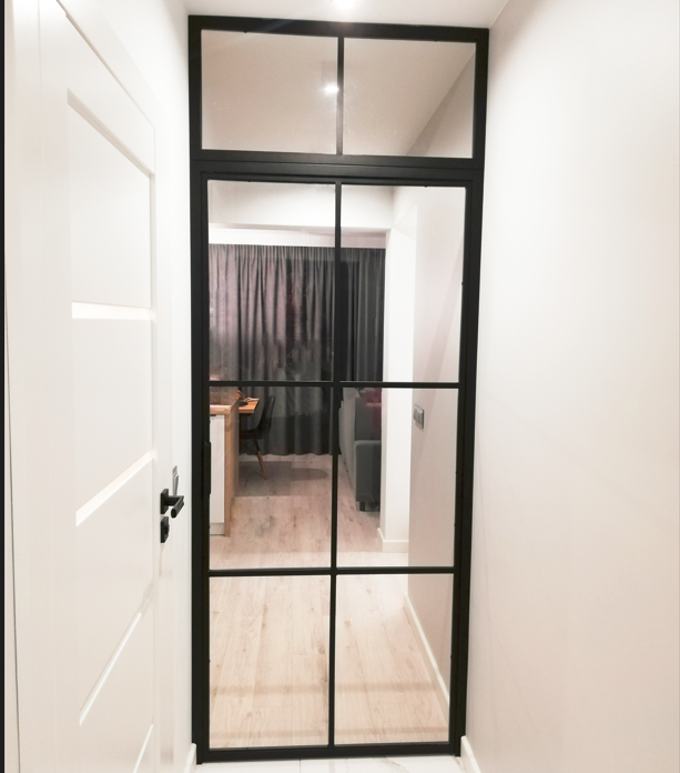 Interior loft door for vestibule with overhead light