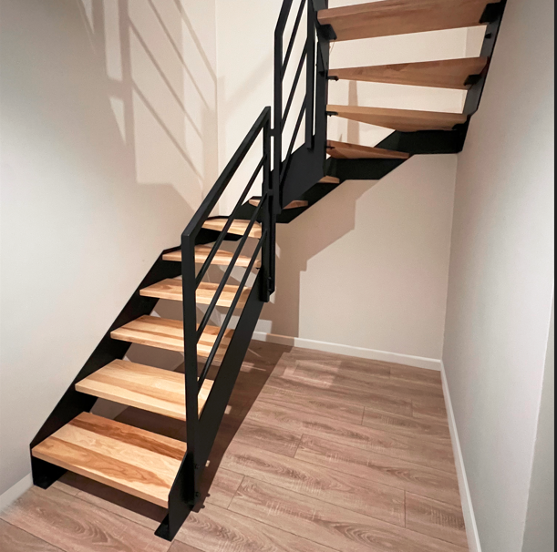 Interior metal and wood staircase with loft railing